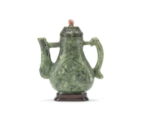 A GEM-INSET SPINACH JADE MING-STYLE EWER AND COVER19th centuryOf flattened pear shape with a long spout opposite a thin strap