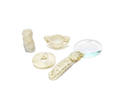 A GROUP OF FOUR WHITE AND GREY JADE CARVINGS17th and 19th centuryComprising: a magnifying glass with a large white jade 'drag