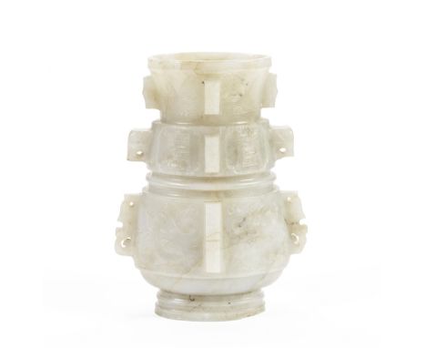 AN ARCHAISTIC PALE CELADON JADE VASE, HUMing DynastyOf pear-shaped form, the exterior decorated with three principal register