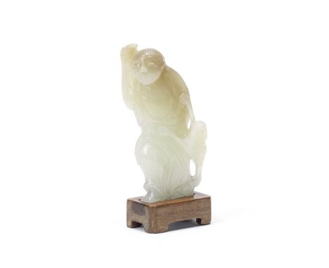 A PALE GREEN AND RUSSET JADE FIGURE OF LIU HAI18th/19th centuryThe Immortal wearing an ample robe revealing the bare chest an