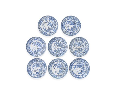 A GROUP OF EIGHT BLUE AND WHITE FLORAL DISHESKangxiEach with a central circular panel of chrysanthemums, prunus and floral sp