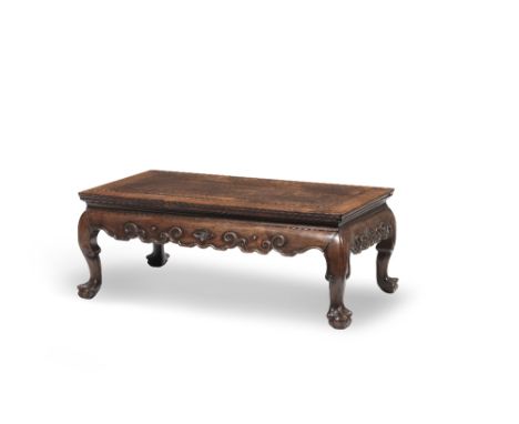 A HUANGHUALI KANG TABLE19th centuryThe mitred top with a rectangular inset panel with beaded edge above a narrow concave wais