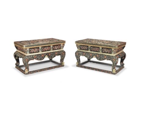 A LARGE PAIR OF GILT AND POLYCHROME BLACK-LACQUERED WOOD CONSOLE TABLESLavishly decorated in polychrome and gilt designs on t