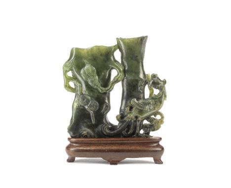 A SPINACH JADE 'PINE AND BAMBOO' DOUBLE VASE19th centuryCarved in the form of a hollow pine trunk with attendant branches, be