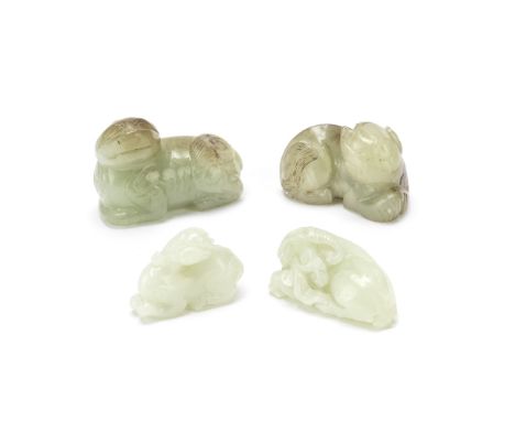 FOUR JADE 'ANIMAL' CARVINGS18th/19th centuryComprising: a luduan seated with the head turned back; a goat carved clasping a l