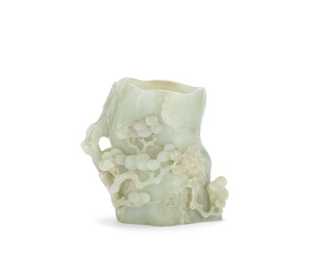 A CARVED JADE 'PINE TRUNK' BRUSHPOT, BITONG18th/19th centuryNaturalistically carved as a section of the trunk of a pine tree,