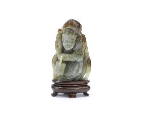 A JADE CARVING OF ZHOU TANZI19th centuryThe figure standing, crouched slightly over a staff in his right hand, the left holdi