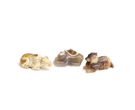 A JADE 'OX' CARVING AND TWO AGATE 'ANIMAL' CARVINGSMing and Qing DynastyComprising: an agate carving of a recumbent ox; a yel