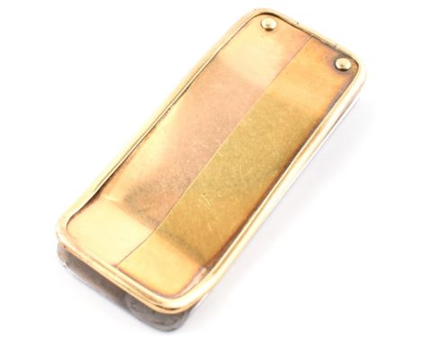 A gold topped money clip. The money clip having a yellow gold front to white tone metal verso. Marked 750 to top. Yellow meta