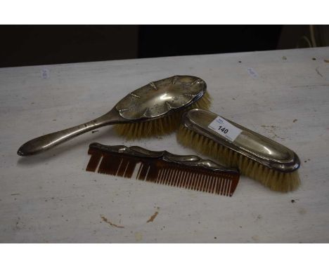 Silver backed three piece dressing table brush/comb set