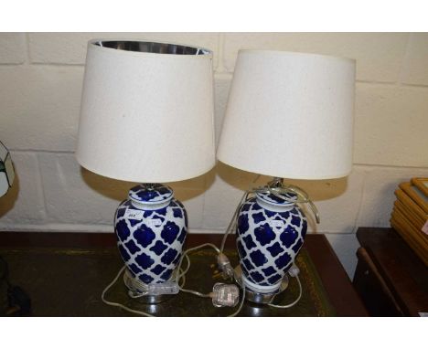 Pair of modern table lamps with blue and white ceramic bases