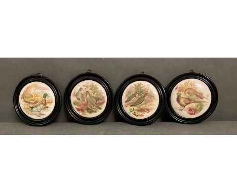 Four framed ceramic pot lids featuring pheasant and partridge 