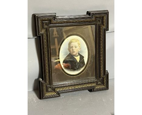 A portrait of a young boy in a sailor uniform, in an ebony style and gilt frame 38cm x 43cm 