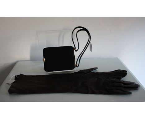 A pair of DENTS lined brown leather gloves and a 1950s compact evening bag. in black satin.
