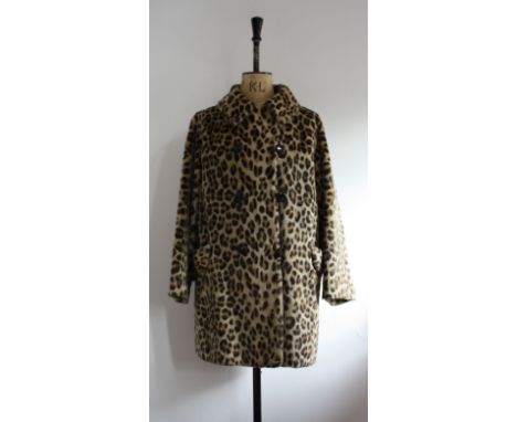 Vintage 1960s leopard print faux fur coat with back belt and glass buttons.