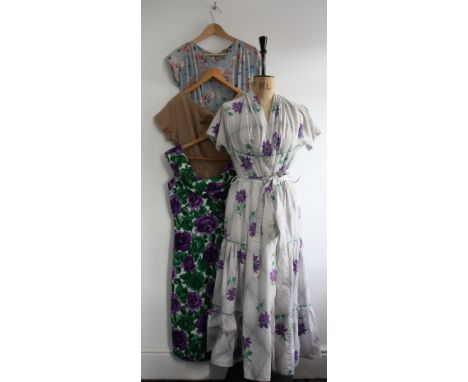A collection of five 40s/50s day dresses. A 40s cotton maxi (28 inch waist), a 40s blue/pink floral (slight damage to the sho