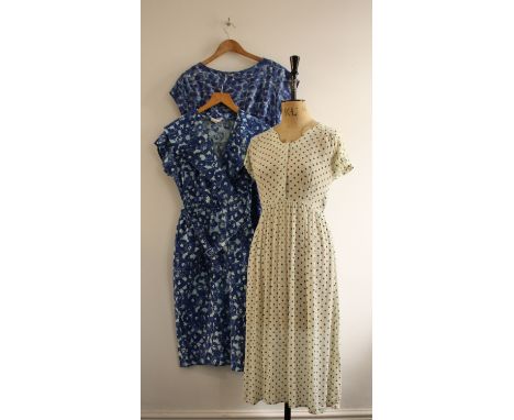 Three vintage ladies dresses of a 30s/40s green/white spotty dress, a 1960s blue print (32 inch waist) and a 1950s blue print