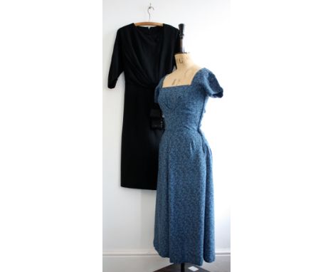 Two 1950s vintage ladies dresses. A blue BBC costume dress (25 inch waist) Small hole in skirt. A black crepe shift with back
