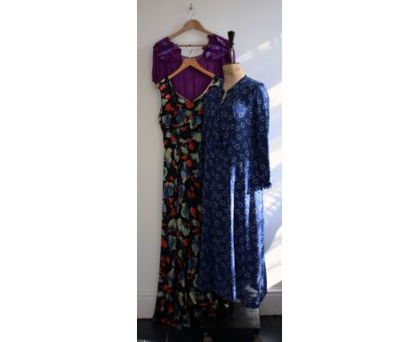 Three 1930s dresses comprising of a blue/white art deco print day dress with jabot and button front in great condition, a bia