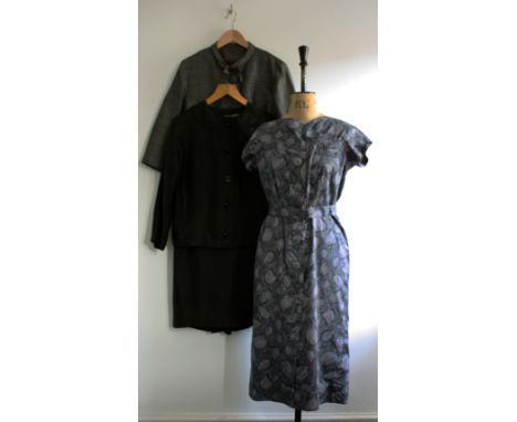 A lot of three vintage 1960s pieces comprising of a grey print SPECTATOR dress, a grey box jacket and a black satin suit (ski