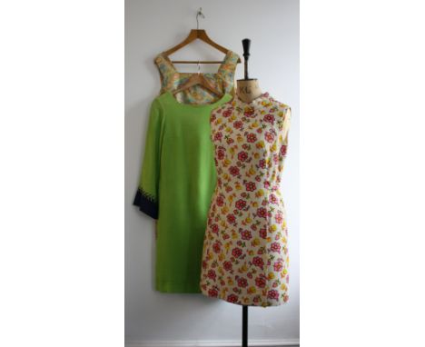 A trio of 1960s dresses comprising of a BLANES floral print shift with back belt, and apple green linen shift with flared bel