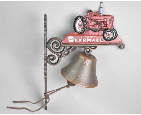 A Cold Painted Cast Metal Wall Hanging Doorbell Decorated with Tractor, 37cms High, Plus VAT