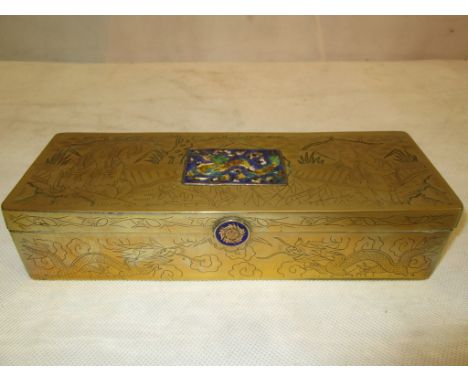 A Chinese brass pen box with enamel plaque