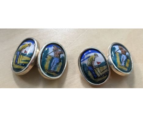 A pair of silver & enamel cuff links in the form of golfers