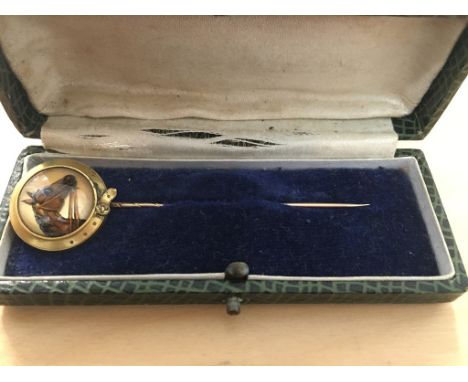 A cased Essex crystal tie pin of a horse in bridle