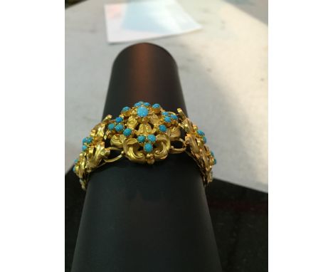 A vintage gold and turquoise bracelet, the central link set with 17 beads and the other links set with three beads each