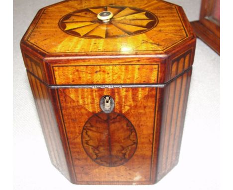 A Regency octagonal tea caddy with ivory finial inlay and burnt work panels