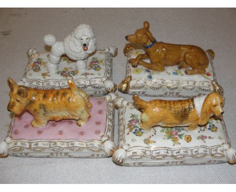 A set of four ceramic 'Dog' boxes