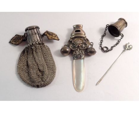 A silver and mother of pearl rattle with whistle, a silver chatelaine thimble, a silver cockeral cocktail stick and a silver 