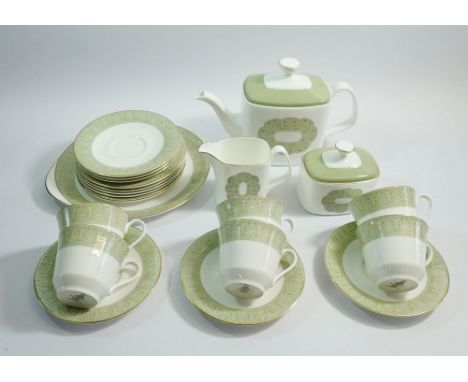 A Royal Doulton Sonnet tea service comprising six cups and saucers, teapot, jug, sugar, six tea plates and cake plate 