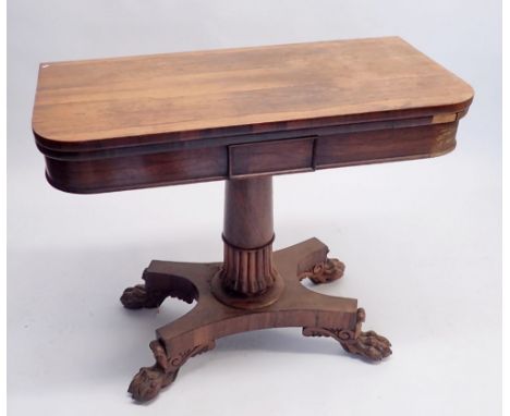 A 19th century rosewood fold top card table on half gadrooned column and quadruple paw feet, 90cm wide 