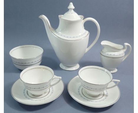 A Royal Doulton Tiara coffee service comprising coffee pot, six cups and saucers, six tea plates, sugar and jug 