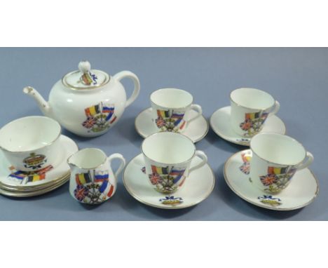A WWI Armistice Day child's tea service comprising teapot, milk jug and four cups and saucers 