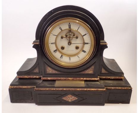 A Victorian large black slate and red marble mantel clock with visible escapement by Ollivant &amp; Botsford, 42cm wide with 