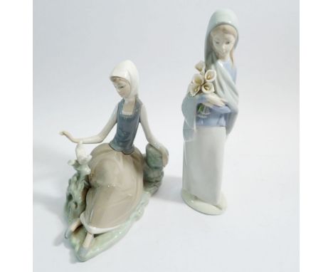 Two Lladro figures of ladies with bird and flowers, 23cm tall 