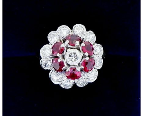 An 18 carat gold ruby and diamond cluster ring, size K, 6.4g 