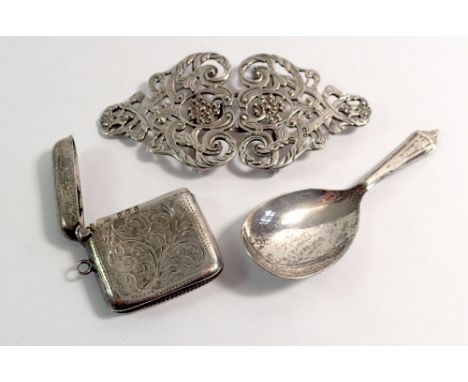 A silver nurses buckle, vesta case and caddy spoon, total weight 86g 