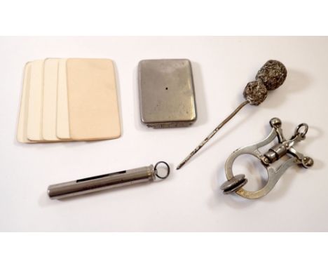 A group of small collectables including skirt lifter, cased egg timer, blank calling cards etc. 