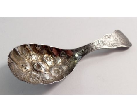 A silver caddy spoon with floral embossed decoration by George Unite, Birmingham 1871 