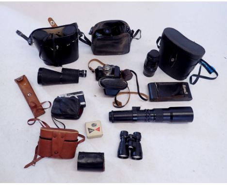 A box of various cameras, binoculars, minocular, lenses etc. including a Fujica half camera, Brownie folding camera, Paragon 