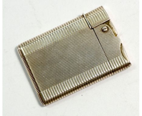 An Asprey silver wafer lighter, engine turned decoration, 46.4g, London 1956 