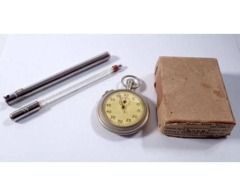 A military stop watch and a 1930's thermometer 
