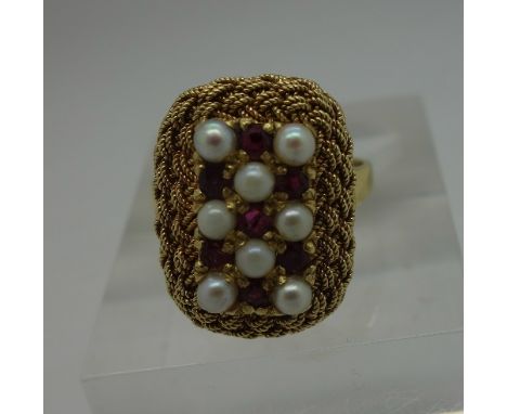 An 18ct gold, pearl and ruby ring, weight 6.4g, size P