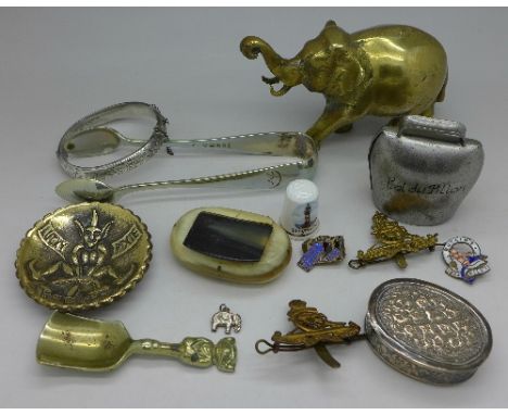 Assorted items including brassware, silver bangle, snuff box, cow bell, badges including Butlins and military