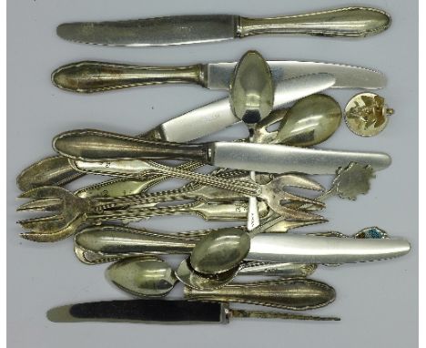 Flatware including silver handled knives