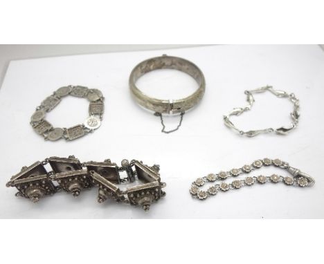 Four silver bracelets and a silver bangle, weight 92g